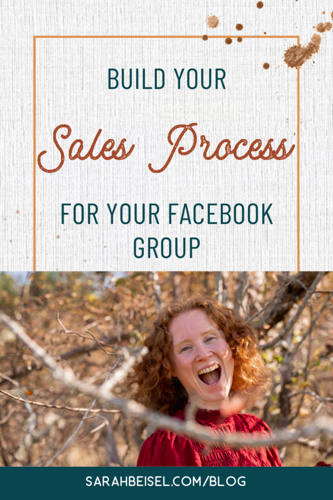 redhead woman smiling in front of trees