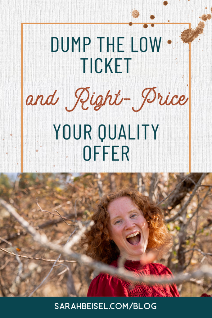 REd-head woman smiling in front of tree